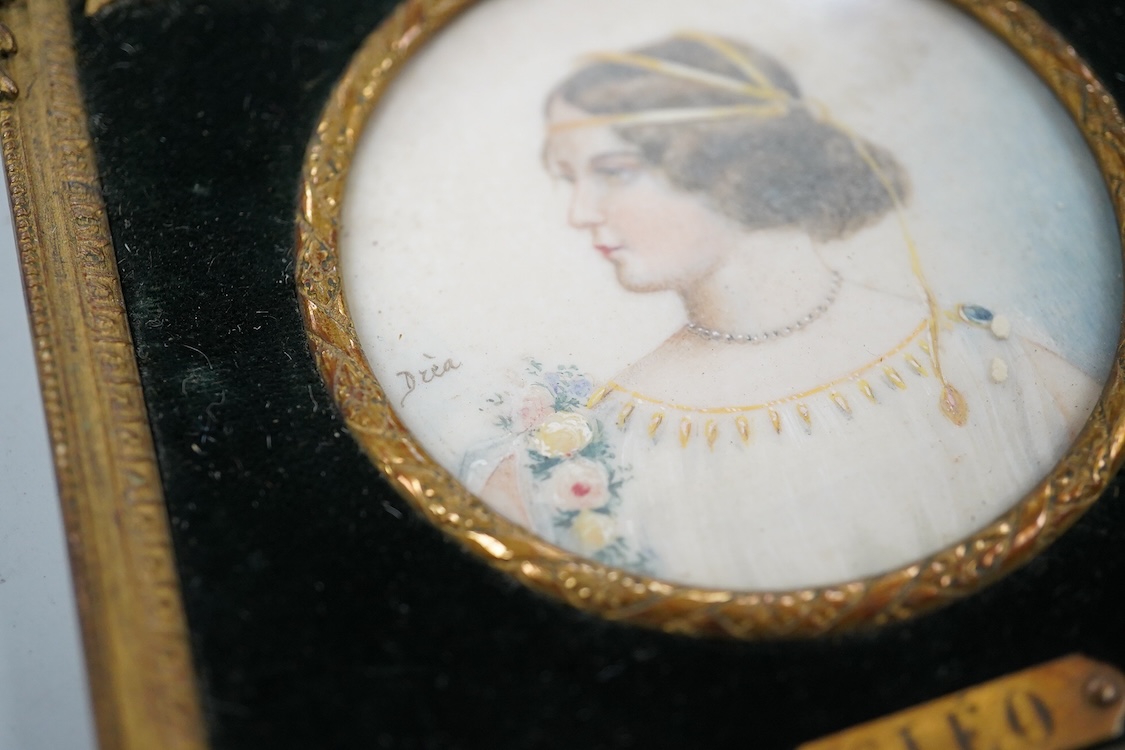 Drea, early 20th century School, Portrait miniature ‘Cleo’, Pre-Raphaelite style, tondo watercolour on ivory, signed, housed in an ornate gilt metal frame, overall 11cm high - CITES Submission reference KB82XPEQ